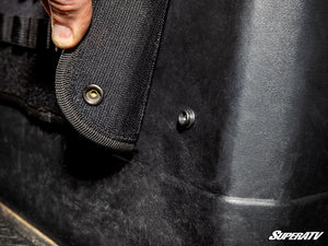 Water-resistant MOLLE door storage bag holding gear on a UTV